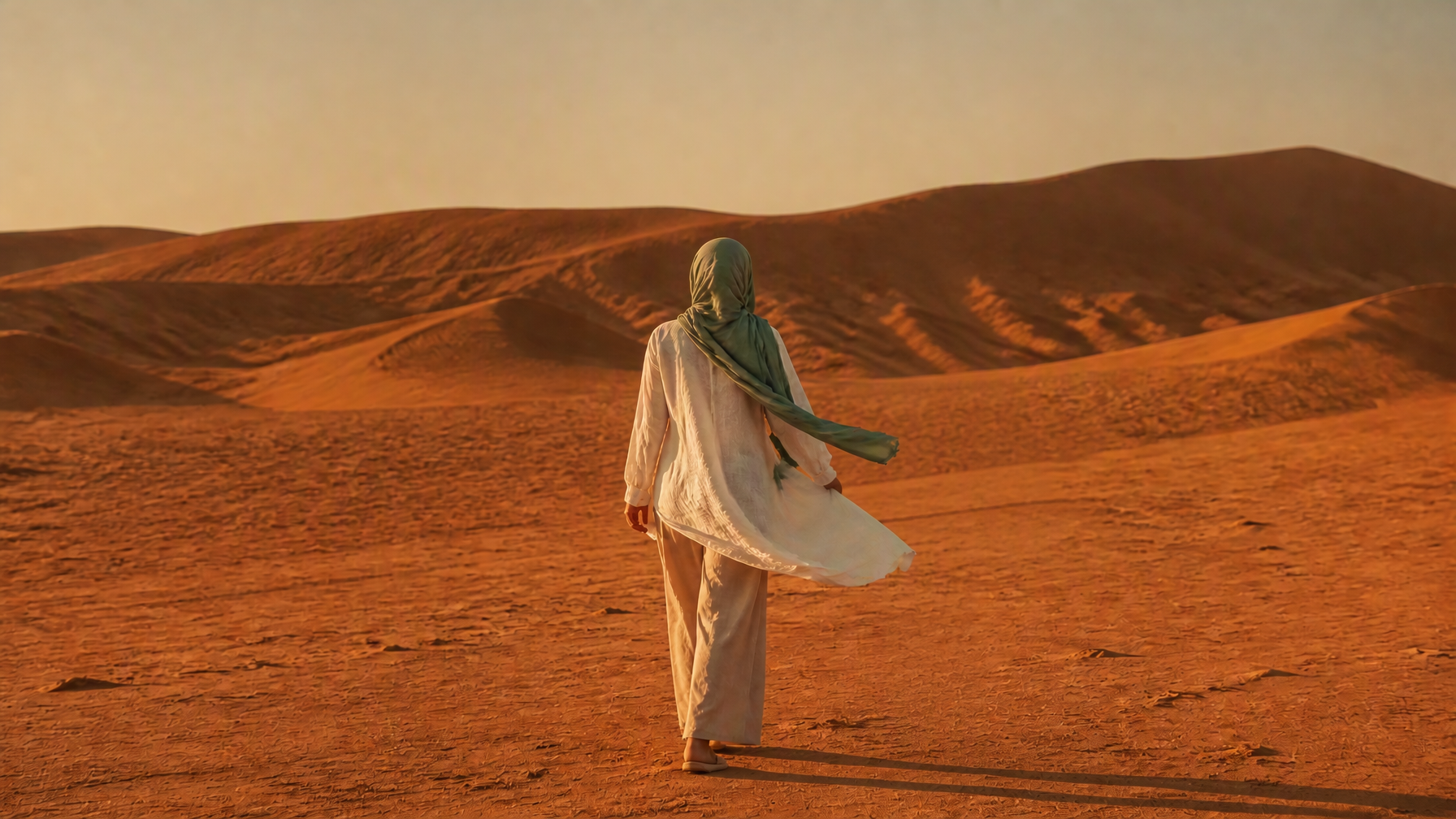 Sage abaya in motion across the dunes — DAMA Edition 014